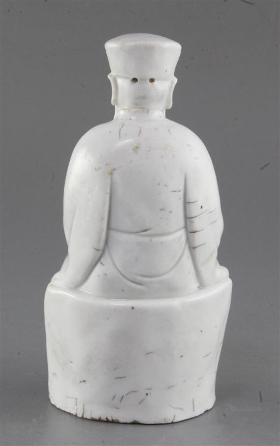 A Chinese Dehua blanc de chine seated figure of a sage, 17th century, height 20.5cm, typical firing imperfections